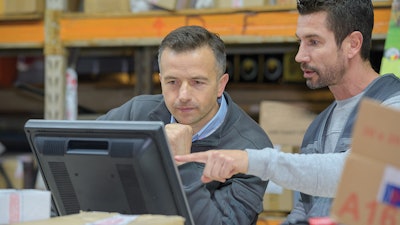 Employees looking at computer