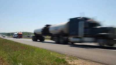 Blurred truck speeding on road