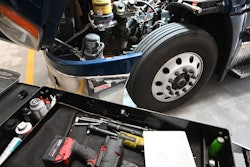 maintenance shop tools and truck with hood up