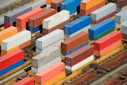 Shipping containers stacked on rail cars