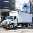 Box truck turning on a city street