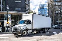 Box truck turning on a city street