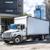 Box truck turning on a city street