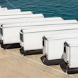 Row of white trailers on pier