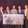 Five men holding a large check at the Ryder Top Technician competition