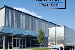A trailer in front of an office building
