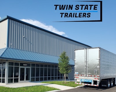 A trailer in front of an office building