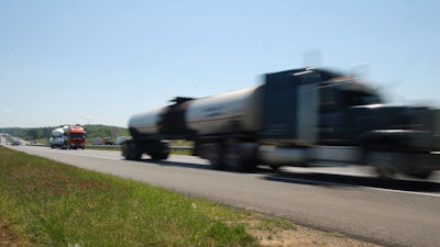 speeding truck blurred driving on the highway