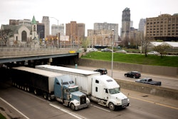 Trucks driving through Detroit on highway