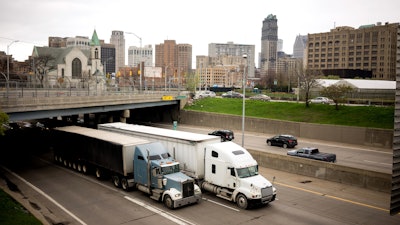 Trucks driving through Detroit on highway