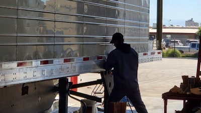 CVTR image of employee working on trailer