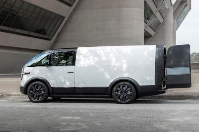 A white Canoo van with the cargo doors open