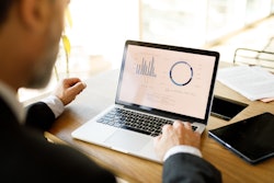 Man looking at computer data