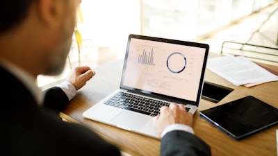 Man looking at computer data