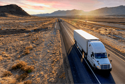 Truck driving in desert downhill