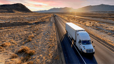 Truck driving in desert downhill