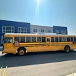 A school bus parked in front of a building