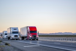 Line of trucks coming into view