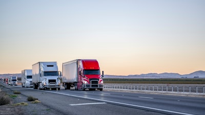 Line of trucks coming into view