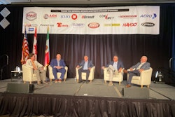 A group of people sit on a stage