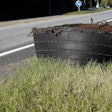 commercial truck tire retread on the side of the road