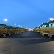 A double line of garbage trucks