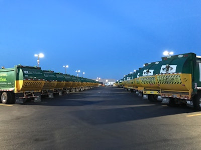 A double line of garbage trucks