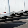 Row of new white trailers in parking lot