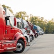 Row of trucks parked in a lot