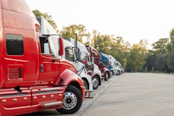 Row of trucks parked in a lot