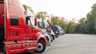 Row of trucks parked in a lot