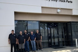 A group standing in front of Wetmores Heavy Duty Truck Parts