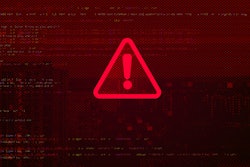 A red warning sign on a red computer background