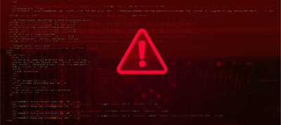 A red warning sign on a red computer background
