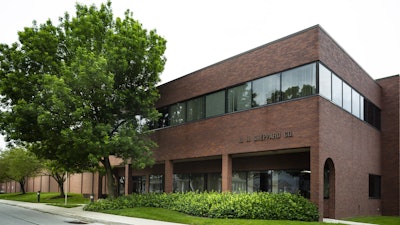 An office building with a sign that says R.H. Sheppard Co.