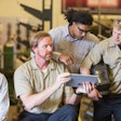 A group of technicians with a tablet