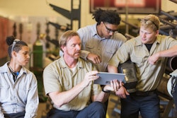 A group of technicians with a tablet
