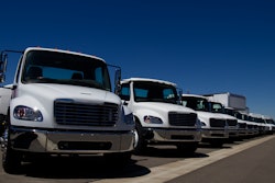 White trucks parked in a line