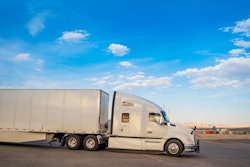 White truck leaving a resting area gas station