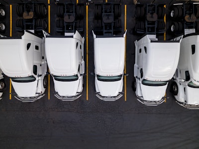 Group Of White Trucks From Above