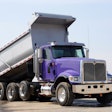 A dump truck with the bed raised