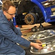 Technician checking a wheel