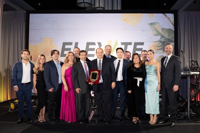 A group of people on stage at the Thermo King Americas dealer principals meeting