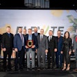 A group of people on stage at the Thermo King Americas dealer principals meeting