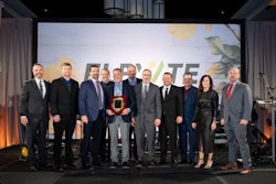 A group of people on stage at the Thermo King Americas dealer principals meeting