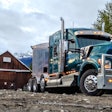 Kenworth Truck in mountains by old barn