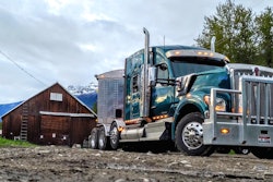 Kenworth Truck in mountains by old barn