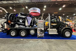 A black cement mixer truck from Kenworth.