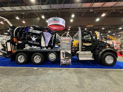 A black cement mixer truck from Kenworth.