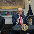 President Donald Trump speaks at a podium
